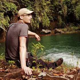 Head of Coasts and Deltas Pieter van Eijk sits near a pond